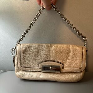 Coach metallic champagne pebble leather wristlet / clutch